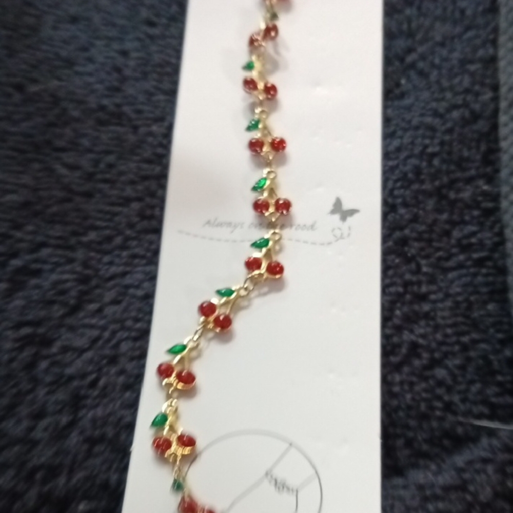 Gold and Red Zigzag Bracelet with Festive Design
